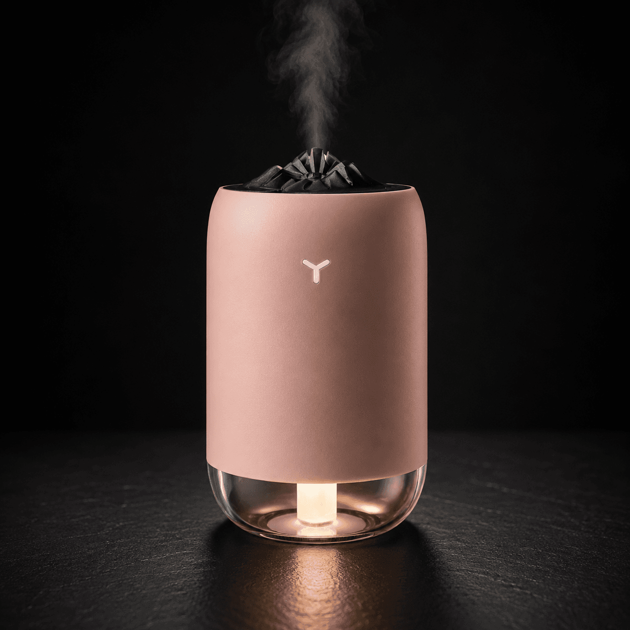 Vomando FlameMist humidifier in pink with glowing base and mountain mist top