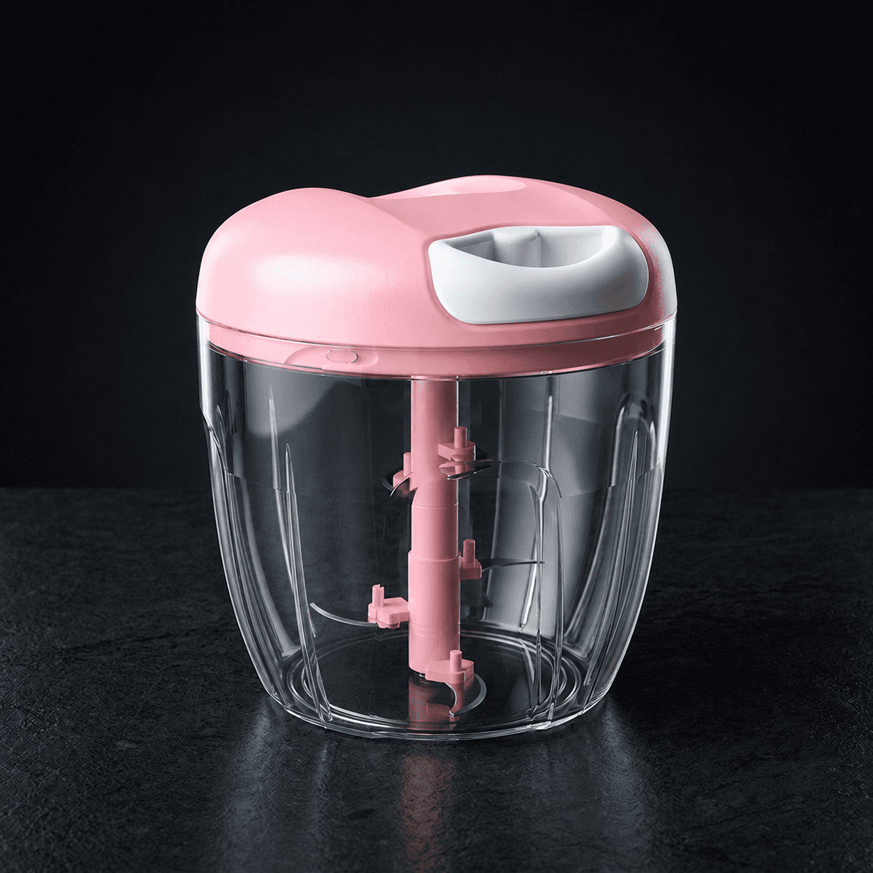 Vomando PowerChop manual food chopper in pink with clear bowl and stainless blades